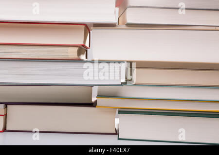 A wall made out of different colored books Stock Photo