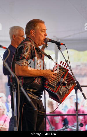 Bruce Daigrepont performs Cajun and Zydeco music at the Richmond Folk Festival, Richmond, VA. Stock Photo