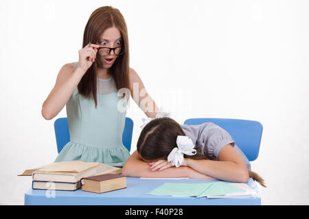 Trainee fell asleep in front of the teacher Stock Photo