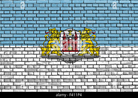 flag of Riga painted on brick wall Stock Photo