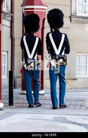 Two soldiers from the Danish Royal Guard on patrol at the Amelienborg Palace, Copenhagen, Denmark Stock Photo