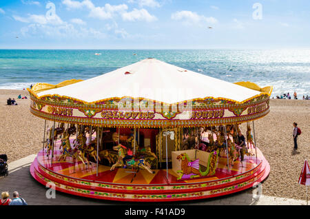 The merry-go-round on Brighton Beach, East Sussex, England. Stock Photo