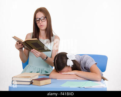 Trainee fell asleep on a boring lesson Stock Photo