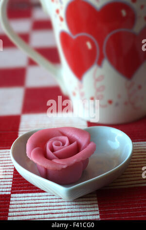 Marzipan Rose and Cup with Heart Decor Stock Photo