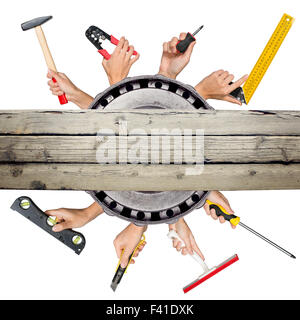 Peoples hands holding tools Stock Photo