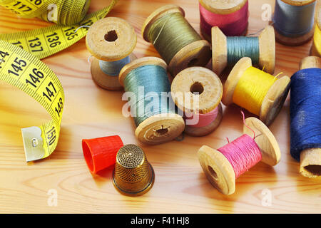 Reels of thread  tapeline and two thimbles