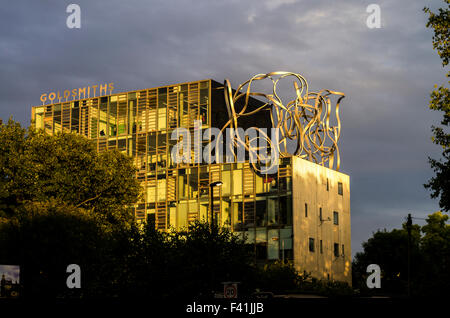 Goldsmiths, University of London, in New Cross, London bathed in dramatic yellow sunlight with a cloudy sky. Stock Photo