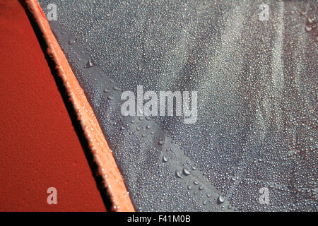 Humidity test water resistant camping tent fabric with morning dew drops on its surface. Waterproofing material. Stock Photo