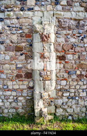 England, Reculver. Buttress on outer wall of the remains of St Mary's 12th century church. Some roman bricks and Anglo-Saxon stone work used in wall. Stock Photo