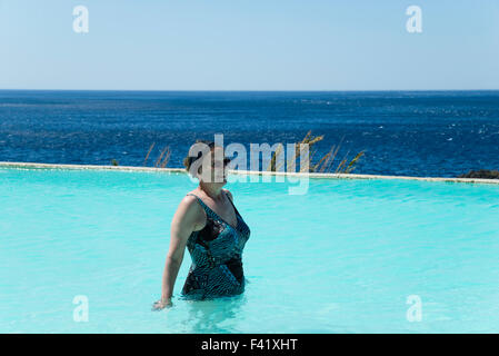 Woman swimming in a swimming pool, Kalypso Cretan Village Hotel, Karavos, Plakias,  Rethymno regional unit, Crete, Greece Stock Photo