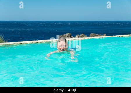 Woman swimming in a swimming pool, Kalypso Cretan Village Hotel, Karavos, Plakias,  Rethymno regional unit, Crete, Greece Stock Photo