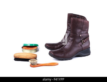 Brown leather boots and polish equipments on white background Stock Photo