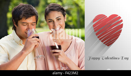 Composite image of cute valentines couple Stock Photo