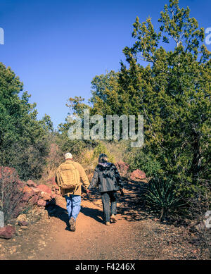Senior couple is hiking on a trail in Tonto Bridge State Park in Arizona Stock Photo