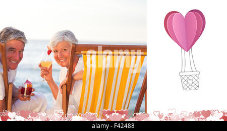 Composite image of cute valentines couple Stock Photo