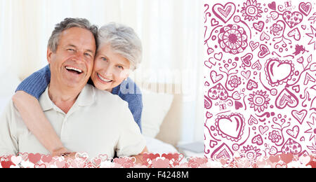Composite image of cute valentines couple Stock Photo
