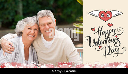 Composite image of cute valentines couple Stock Photo