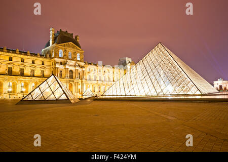 PARIS-DECEMBER 06: The Louvre Art Museum on December 06, 2012 in Paris, France. A central landmark of Paris, over 35000 objects  Stock Photo