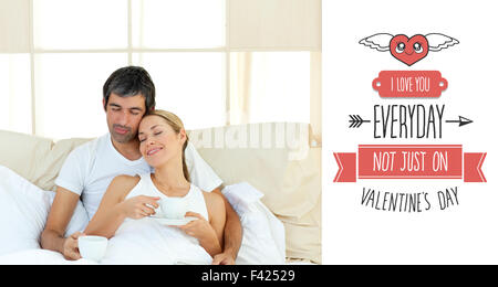 Composite image of cute valentines couple Stock Photo