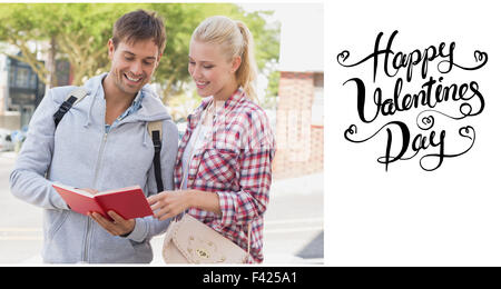 Composite image of cute valentines couple Stock Photo