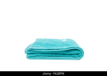 Folded towel viewed from the side and isolated on a white background Stock Photo