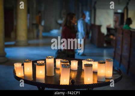 Candles church darkness, view of votive candles on display in Trieste Cathedral (Cattedrale di san Giusto), Italy. Stock Photo