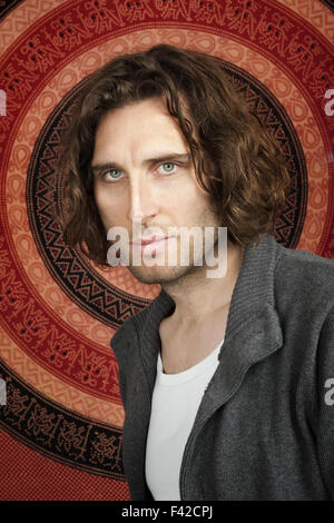 young man curly hair Stock Photo