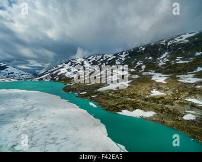 Frozen lake by Gamle Strynefjellsvegen national tourist road in Norway Stock Photo