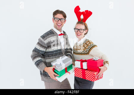 Geeky hipster couple holding presents Stock Photo