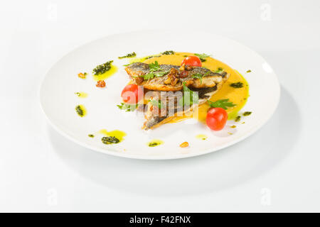 Grilled Fish with tomato and Mixed Salad Stock Photo