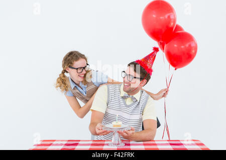 Geeky hipster couple celebrating his birthday Stock Photo