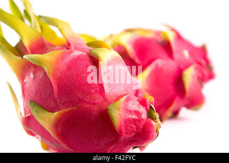 Close-up shot of three exotic dragon fruits, selective focus, isolated on white background Stock Photo