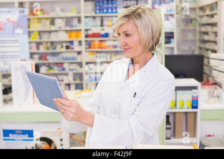 Pharmacist using tablet pc Stock Photo