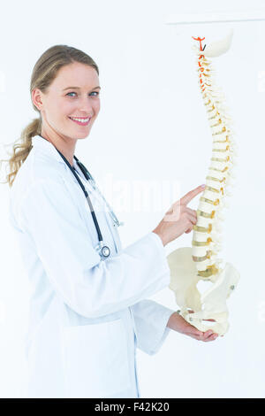 Female doctor with anatomical spine Stock Photo