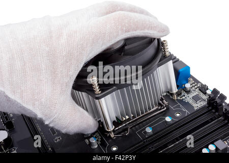 Installing CPU cooler on modern PC computer Stock Photo