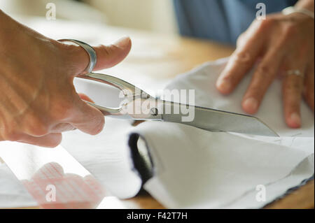 Woman cutting sewing pattern, cropped Stock Photo