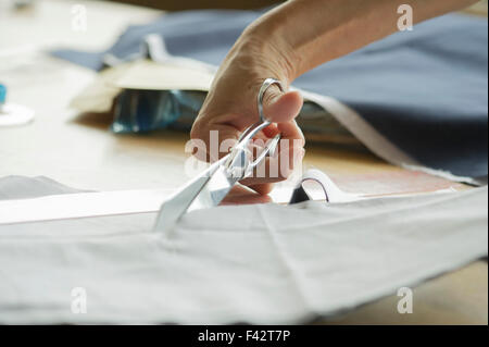 Woman cutting fabric, cropped Stock Photo