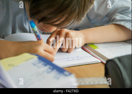 Boy doing homework Stock Photo