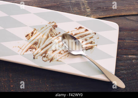 Empty dessert plate smeared with chocolate Stock Photo