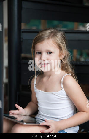 Little girl using digital tablet, portrait Stock Photo