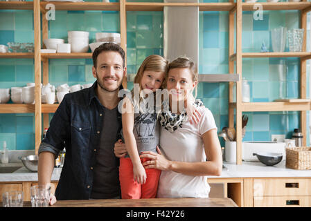 Family at home together in kitchen, portrait