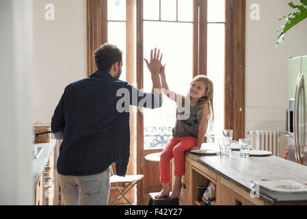 Father and daugther high-five Stock Photo