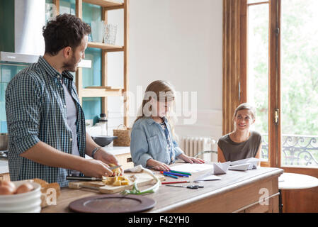 Family spending time together in kitchen Stock Photo