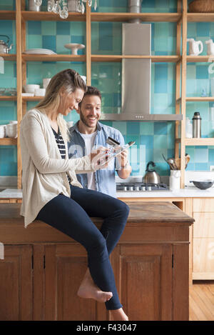 Couple shopping online at home Stock Photo