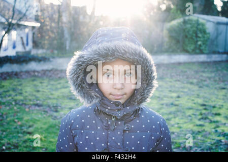 Girl wearing hooded coat, portrait Stock Photo