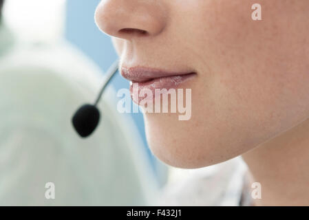 Close-up of operator wearing headset Stock Photo