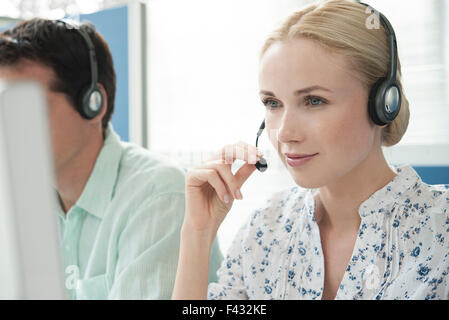 Woman working in call center Stock Photo