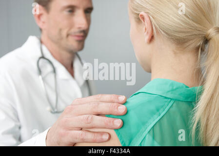 Doctor reassuring patient Stock Photo