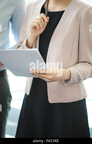 Office worker reviewing document Stock Photo