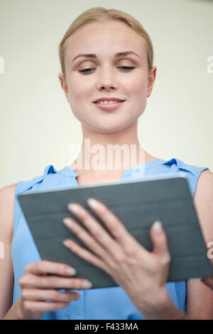 Woman using digital tablet Stock Photo